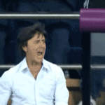 Joachim Low jumping up and down