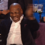 Mike Tyson clapping and laughing