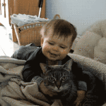 Baby Hugging Cat