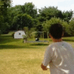Kid Throws Frisbee Through Trampoline in Bucket