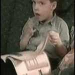 kid pretending to read like grownup