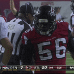 Atlanta Falcons Sean Weatherspoon Celebrates in front of Peyton Manning