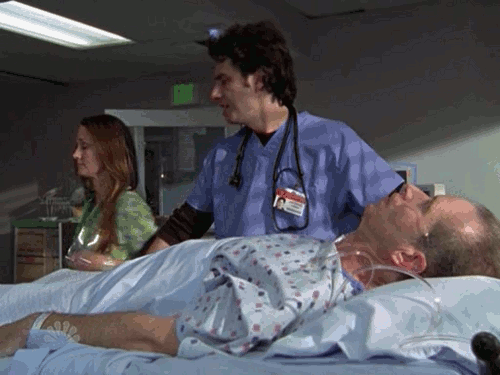 Scrubs-JD-pours-Kittens-on-Patient.gif