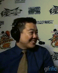 Fighting game commentator James Chen reacting after a game announcement. - James-Chen-Laughing