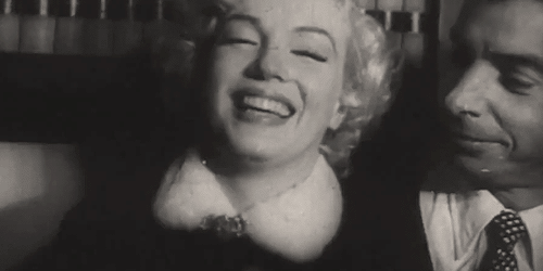 Marilyn-Monroe-and-Joe-Dimaggio-Laughing.gif