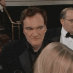 Quentin Tarentino Spits Out Champagne