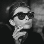 Audrey Hepburn Pulls Down Glasses