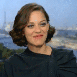 Marion Cotillard Smile and Lip Bite Flattered