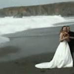 Wave Knocks Down Bride and Groom