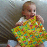 Excited Baby Opening Present