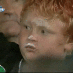Kid Rubs Ice Cream on Face