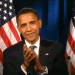 Barack Obama Clapping in Front of American Flags
