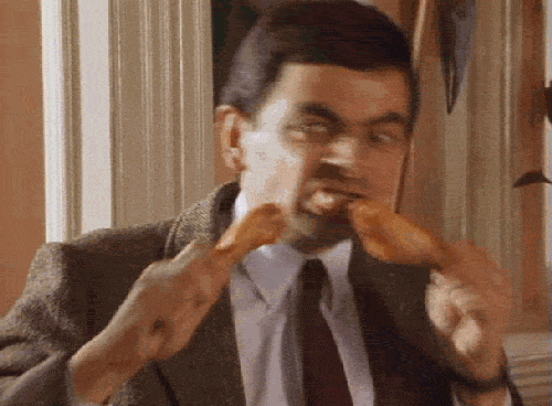 Mr-Bean-Eating-Chicken.gif