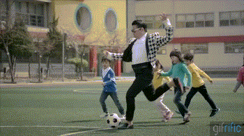 PSY-Kicks-Soccer-Ball-Away-From-Kids-Gentleman.gif