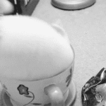 Cat Sitting in Tea Cup