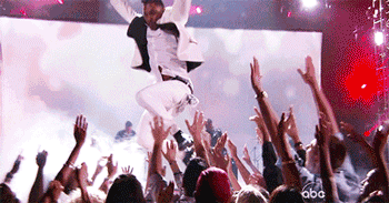 Miguel-Jumps-On-Fan-in-BMA-Crowd.gif