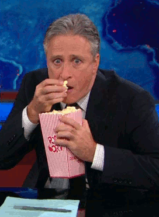 Jon-Stewart-Eating-Popcorn.gif