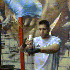 Boxer-Amir-Khan-Punches-Bottle-in-the-Air.gif