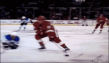 hockey-crash-into-camera.gif