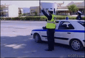 Motorcycle-Police-Officer-High-Five.gif