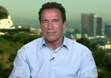 Arnold-Schwarzenegger-Listening-then-Laughing.gif