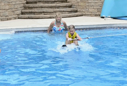 Dog-Jumps-on-Kid-in-Pool.gif