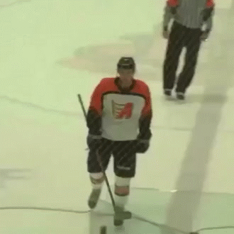 Hockey-Player-Runs-Into-Stick-Leaving-Ice.gif